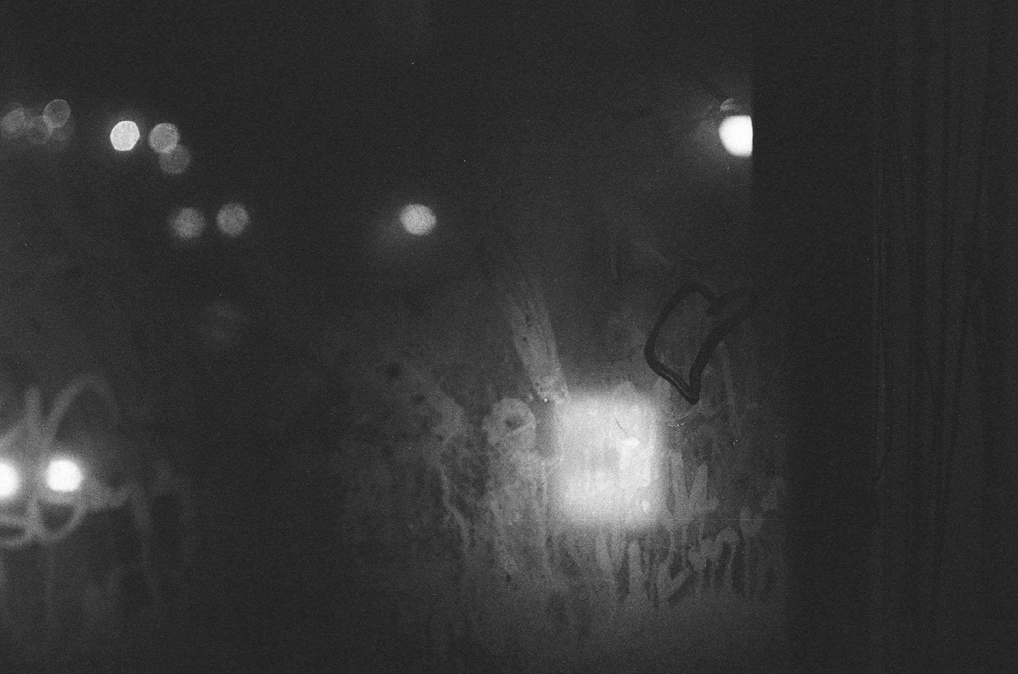 Black and white photo of misty window with heart