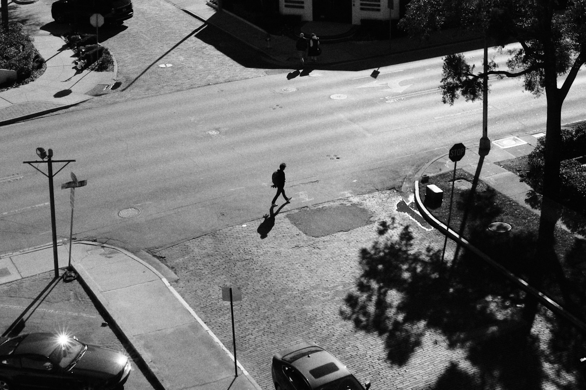 Black and white photo of person crossing street in Orlando