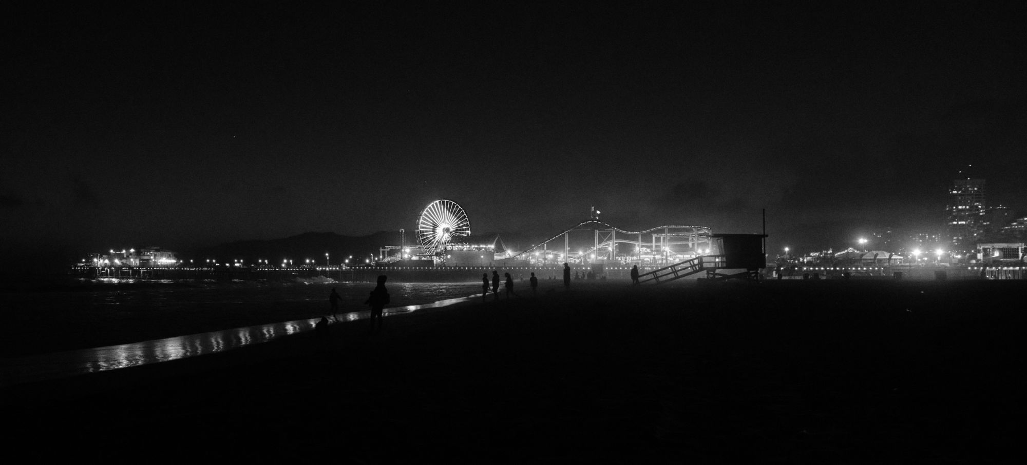 Black and white photo of LA beach at night