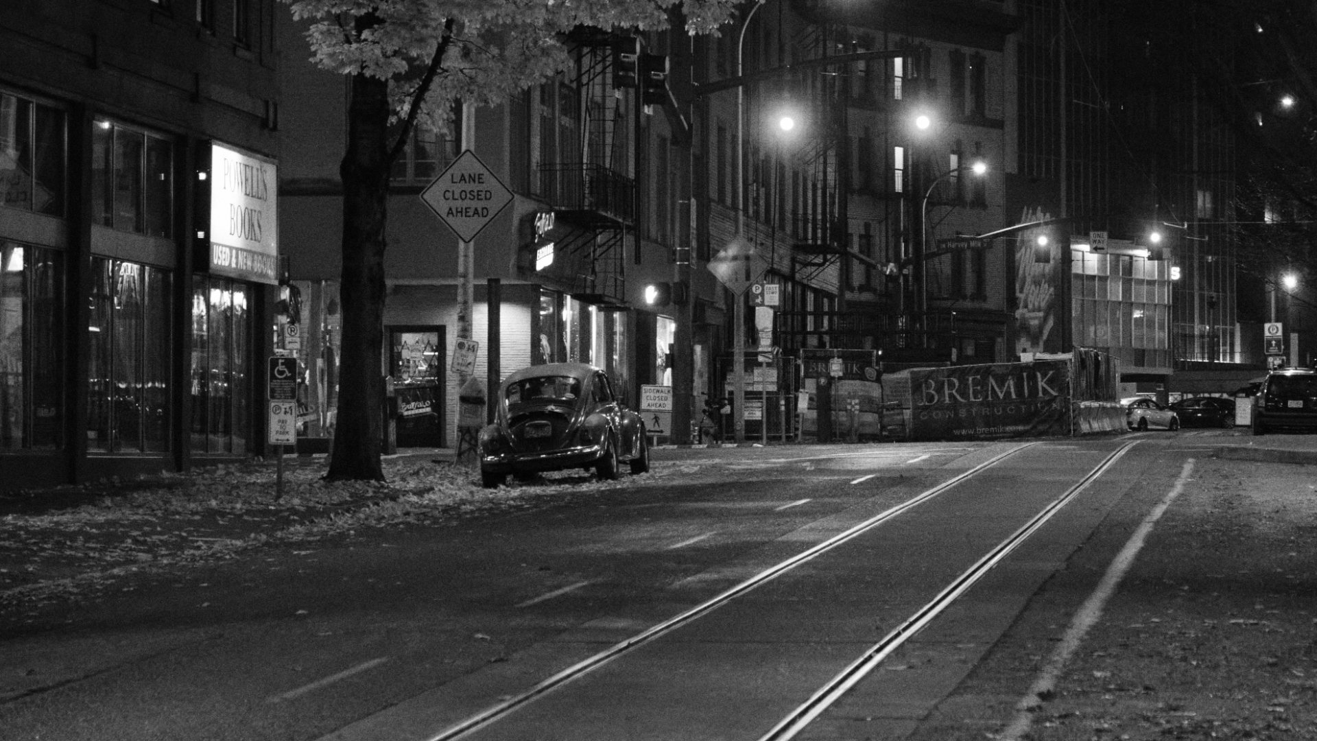 Black and white photo of VW Bug in Portland streets at night